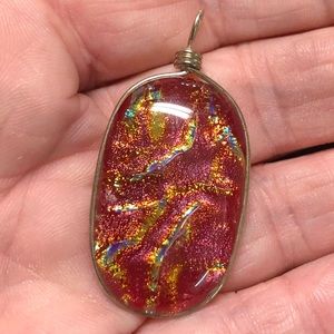 Silver wrapped orange glass pendant